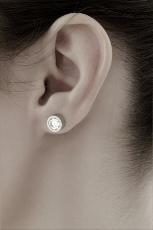 earrings 13 by stuart moore, platinum round diamond stud worn on the ear