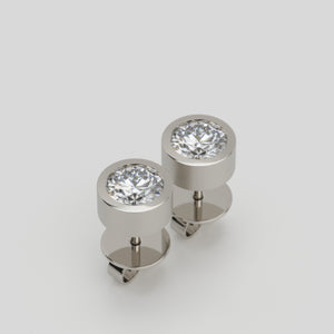 earrings 13 by stuart moore, platinum studs with round brilliant center diamonds