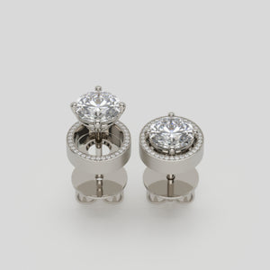 earrings 21 by stuart moore, four-prong platinum studs with pavé jackets